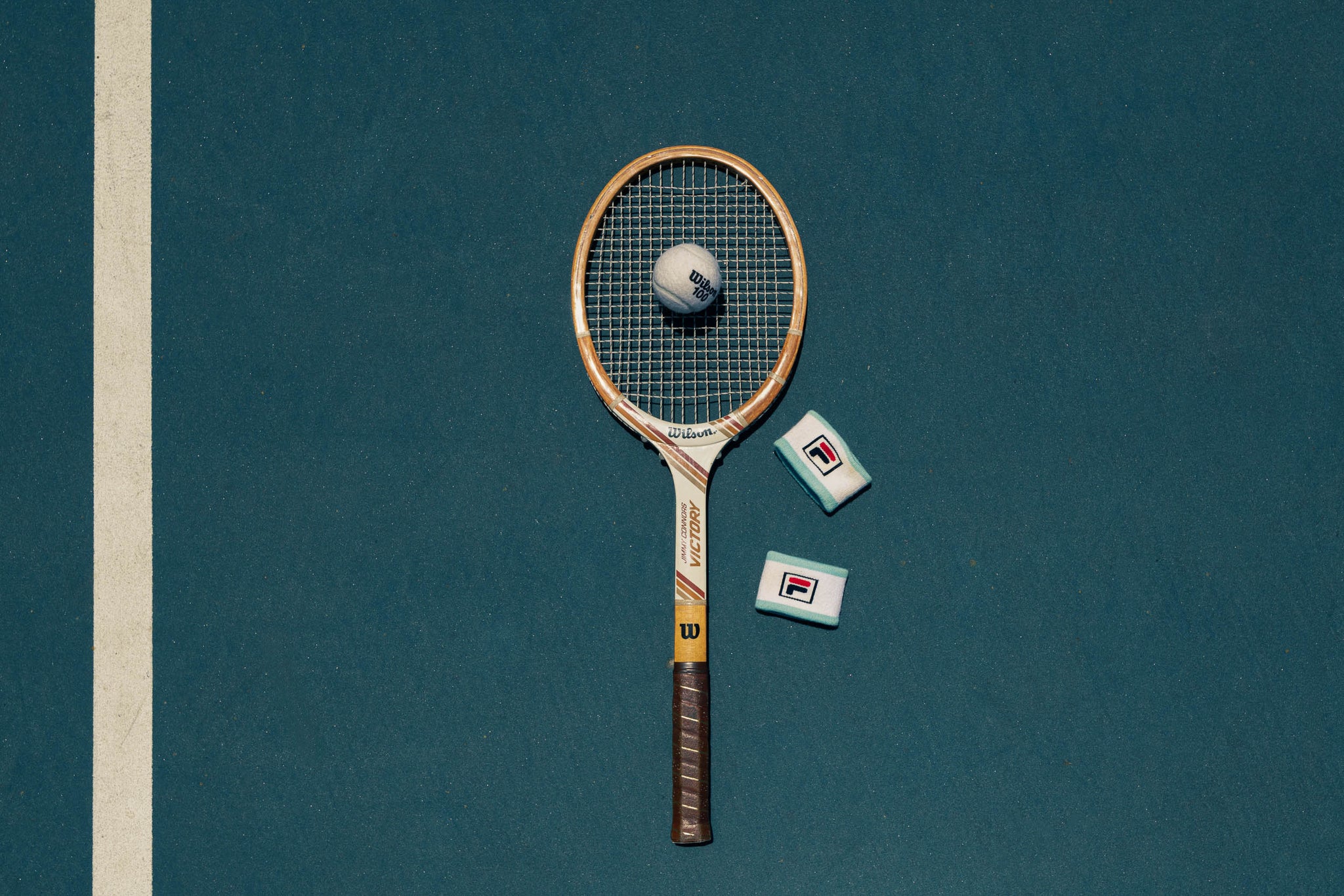 Close-up of classic tennis ball and wood racket – nostalgic sports photo
